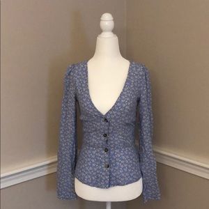 Light blue H&M top with floral detail